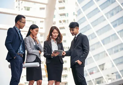Diverse Business Team Meeting with Tablet Outdoors